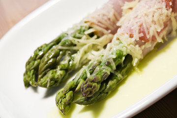 green asparagus wrapped in ham