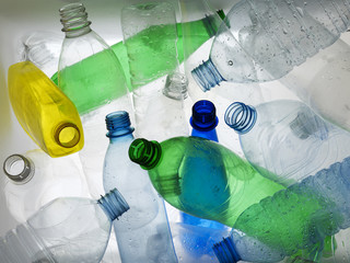 Backlit collection of colourful plastic bottles