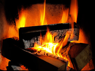 flames of burning firewood in a fireplace