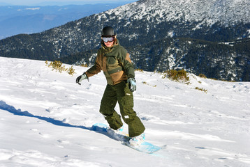 Fototapeta na wymiar Snowboarder woman under sun