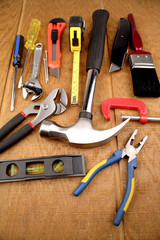 Assorted tools on wooden surface