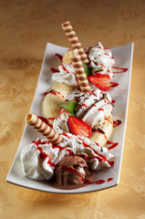 Banana split with different sort of ice cream and fruit - 13733274