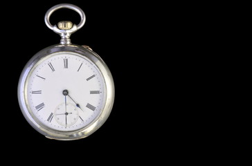 silver pocket watch isolated on black background