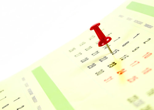 Red Thumb Tack On Calendar