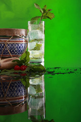 Cuban Mojito cocktail, muddler and bongo