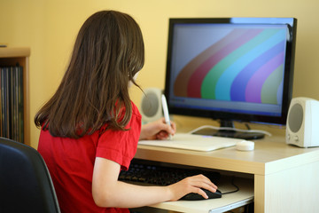 Fototapeta na wymiar Girl using computer at home
