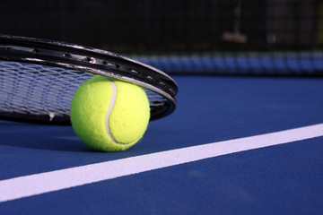 Tennis ball and racket
