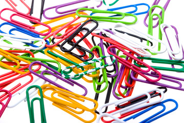 Color paper clips to background. Isolated on white