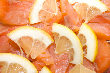 Close up of red fish with a lemon