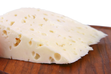 white goat hard cheese front view