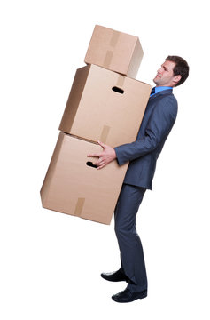 Businessman carrying boxes