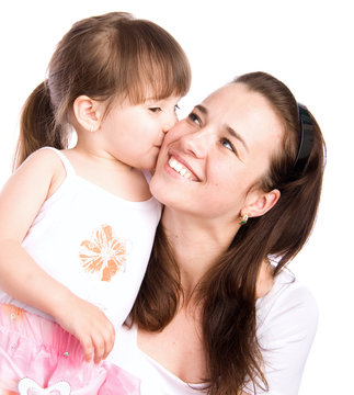 Lovely girl kissing her mother