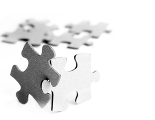 Fototapeta premium Grey puzzle isolated on white