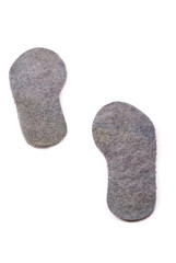 Warm grey woollen insoles for footwear.