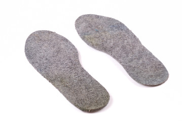 Warm grey woollen insoles for footwear.