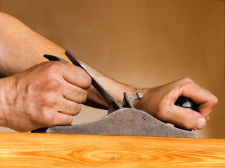 Hands man's with the tool a plane