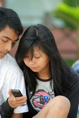 asian young couple with gadgets