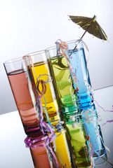 Shot glasses with umbrella and streamers