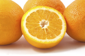 Group or oranges isolated on white background. One cut in half.