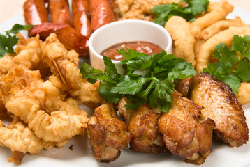 Grilled sausage with sauce and chicken