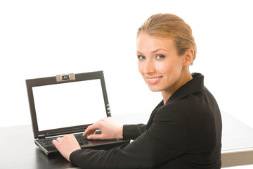 Young businesswoman working on laptop, isolated on white