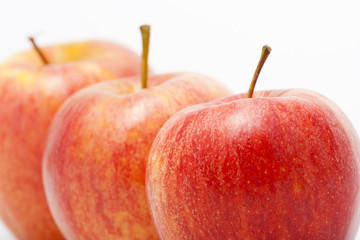 Three ripe red apples