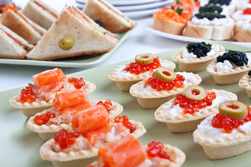 group of canapes and sandwiches with seafood