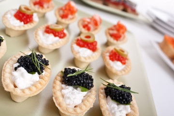 large group of canapes with caviar and salmon