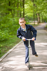 Cute kid on scooter