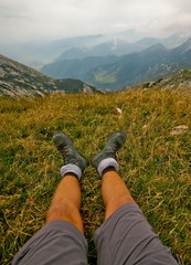 Hiker legs with view on alps