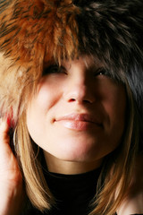 portrait of a beautiful girl in a fur hat