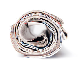 The newspaper curtailed into a tube on a white background