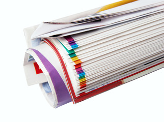 The newspaper curtailed into a tube on a white background