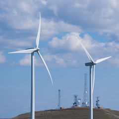 Telecommunications towers and wind turbines