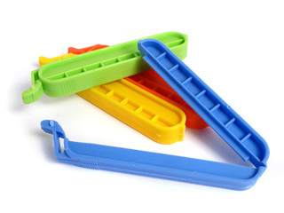 Clips for food Bags in various colors on white background