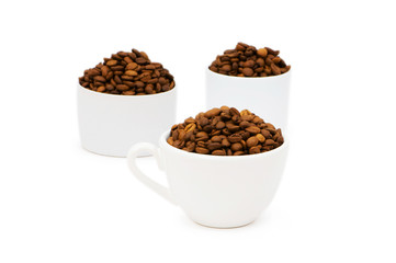 Cup and coffee beans isolated on the white