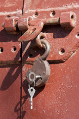 opened padlock hanging with keys