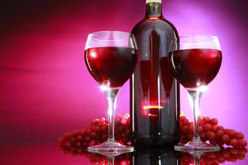 Red wine bottle and grapes
