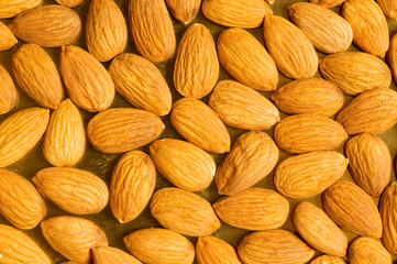Fresh almonds arranged as a background