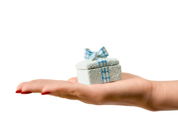 Female hand holding a gift box