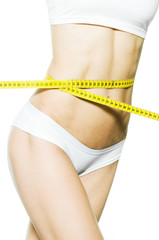 Schlanke Taille mit Maßband