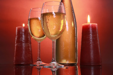 White wine glasses and candles