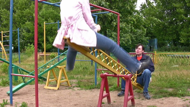 couple on seesaw