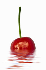 cherries dropped into water