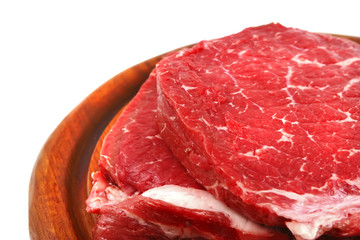 Obraz premium bloody meat on wooden plate