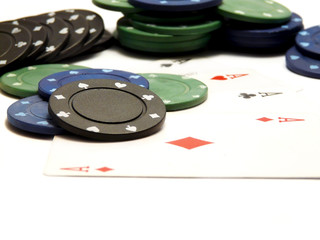 Four aces cards and casino chips