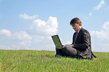 Businessman working with a laptop outdoor
