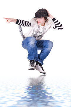 Teenage Boy Jumping And Dancing Locking Or Hip-hop Dance