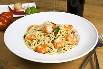 pasta dish with black tiger prawns