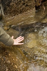 hand and river